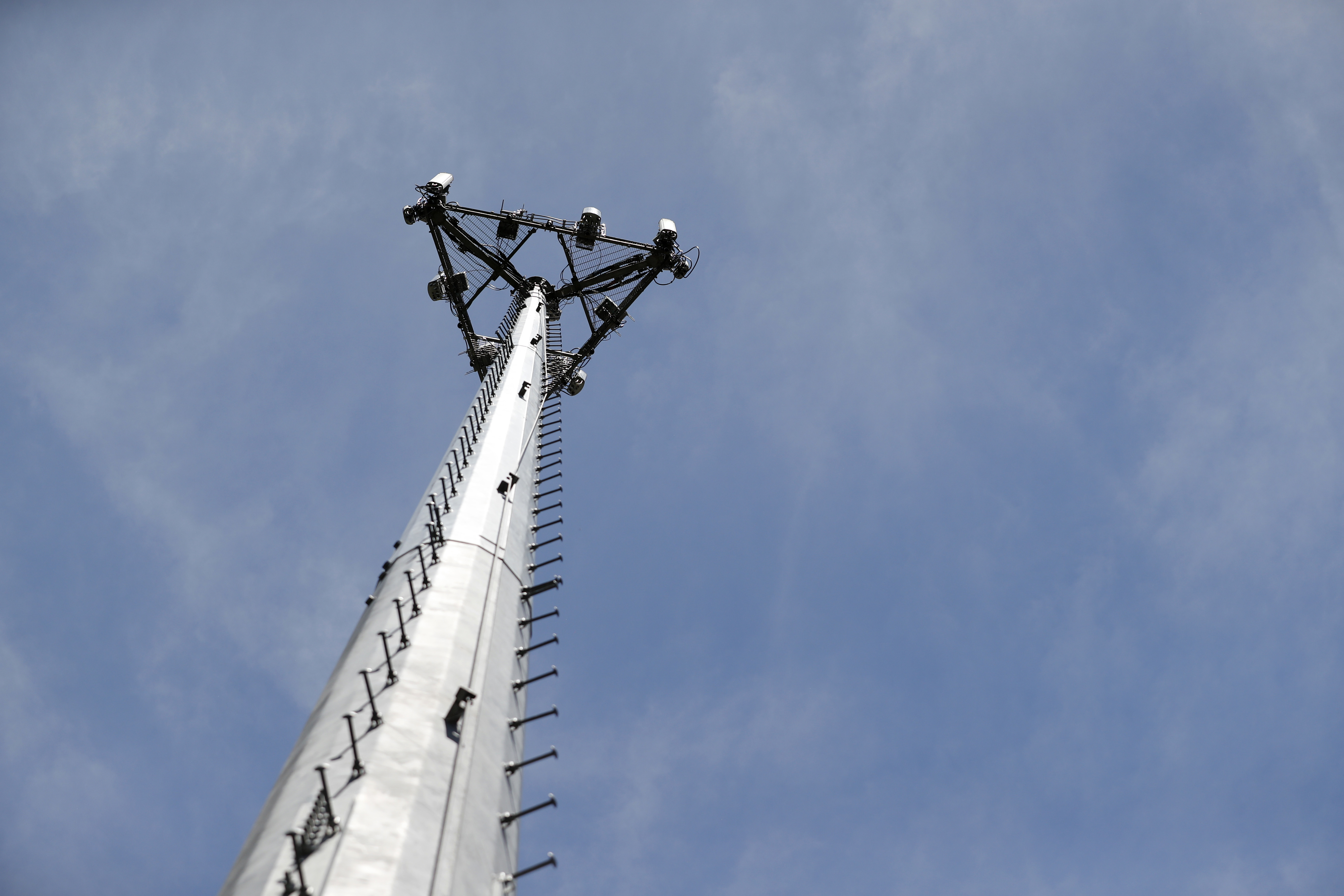 Looking up at a cellular phone tower