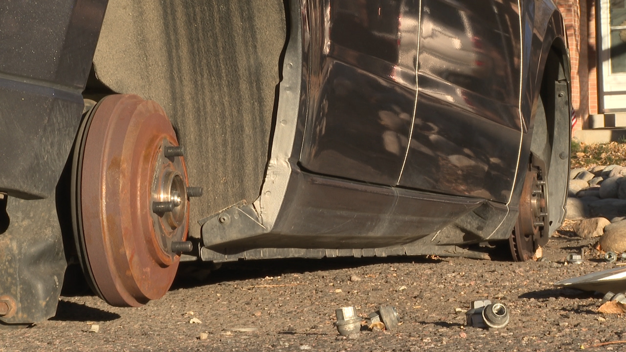 A car in Wheat Ridge, Colorado with it's tires stolen