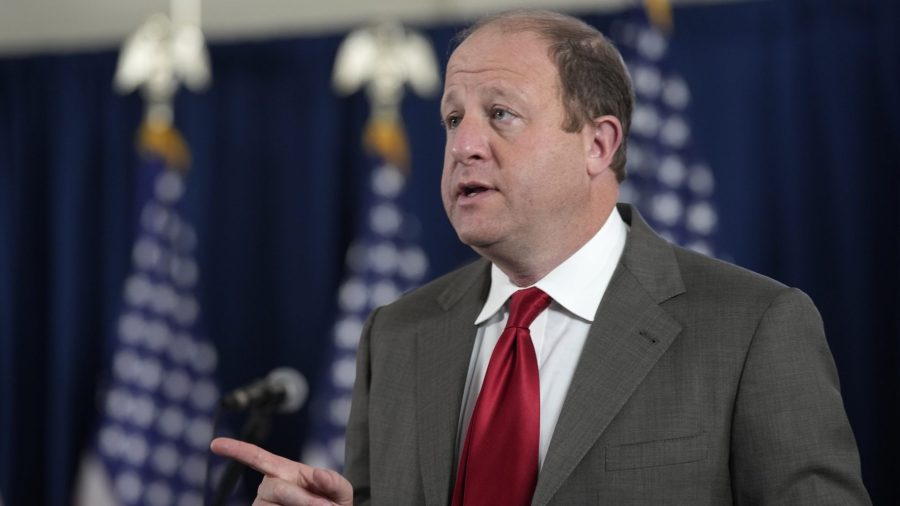 Colorado Gov. Jared Polis speaks during a news conference on the state's response to the COVID-19 pandemic, Tuesday, Dec. 7, 2021, in Denver.