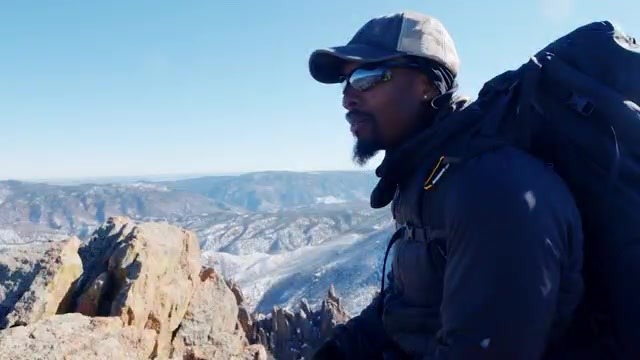 Evan Gill, the "Black Sherpa," atop Cathedral Spires in Colorado