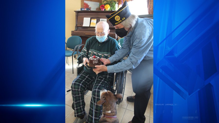 George Blake is given a 101st birthday cake inside the nursing home