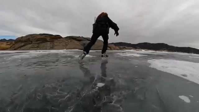 Colorado Parks and Wildlife ranger Kelli Lewis patrols on skates on frozen ice at Eleven Mile State Park