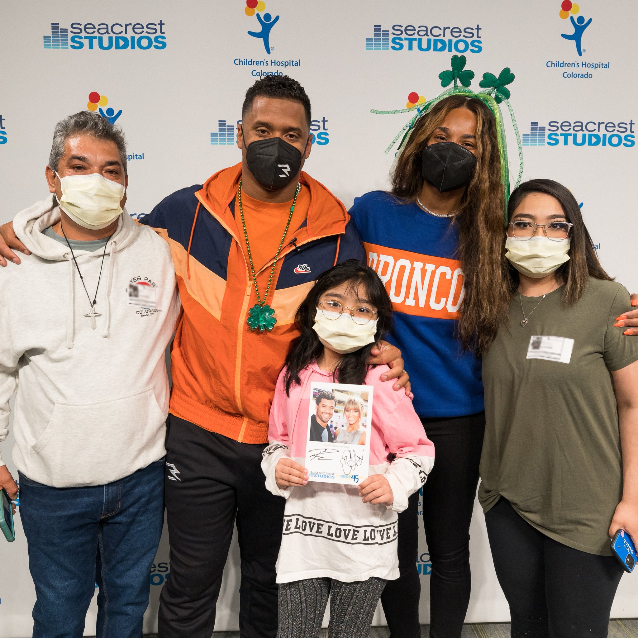 Russell Wilson and Ciara pose for a photo at Children's Hospital Colorado