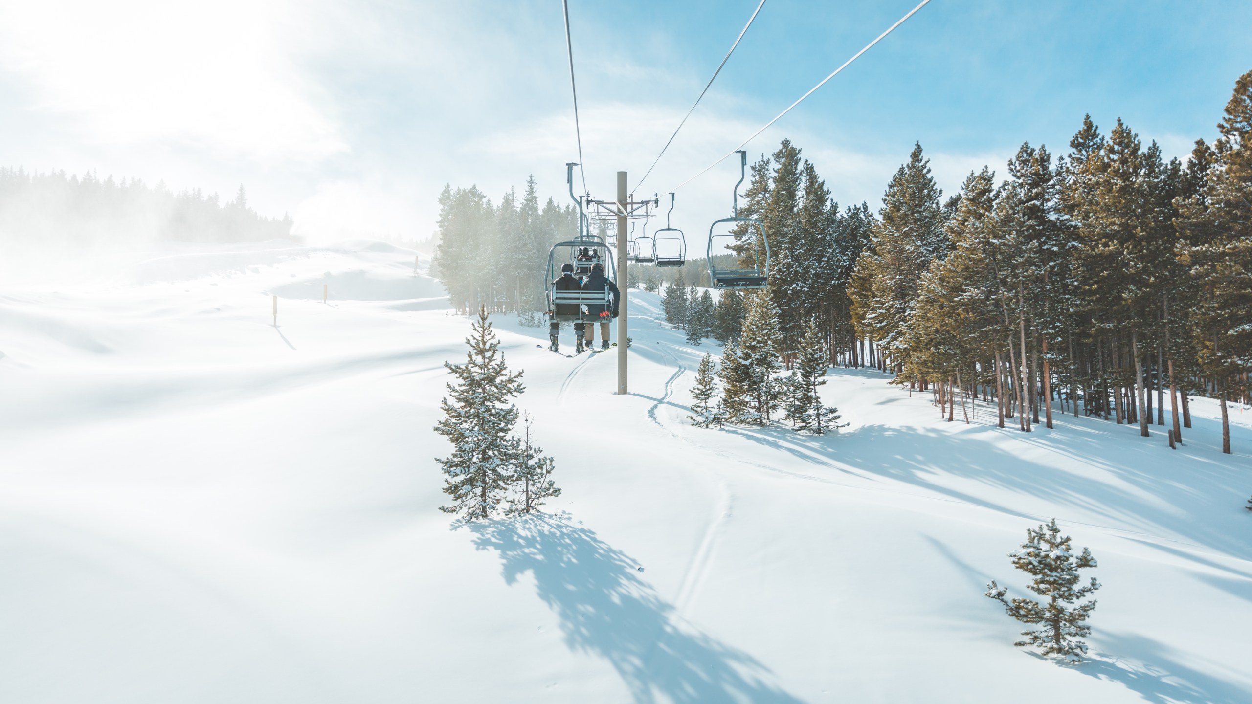 View of untracked ski slope and ski lift in Breckenridge ski resort.