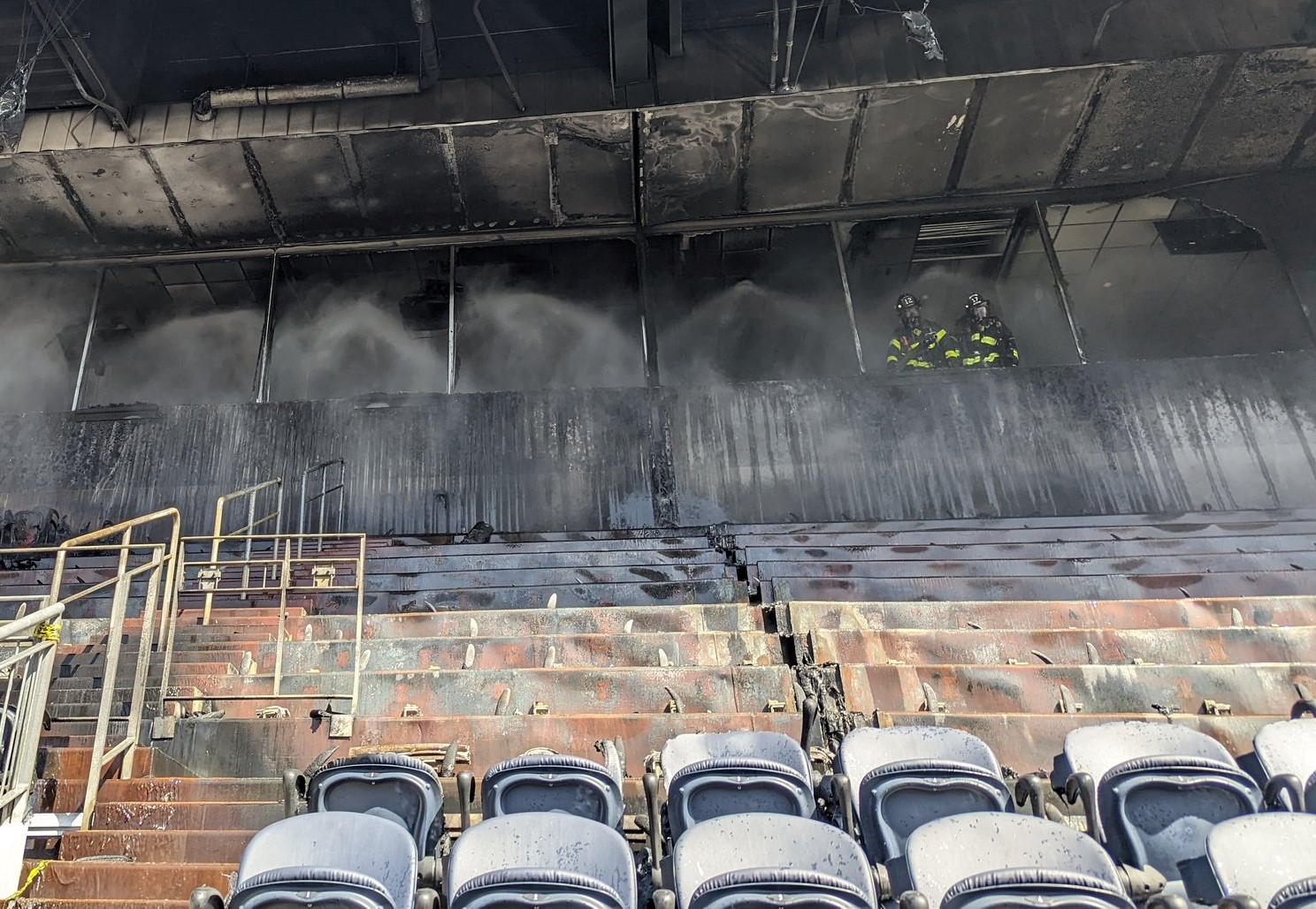 The aftermath and damage from a fire at Empower Field