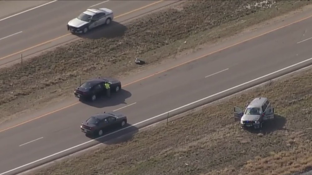 A police vehicle is off the road and damaged