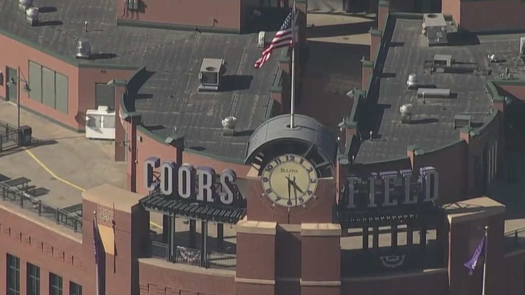 Aerial view of Coors Field sign and American flag during the day