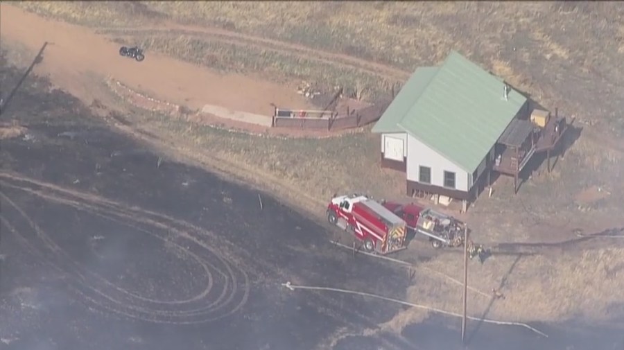 Fire vehicles in area of fire burning north of Lyons