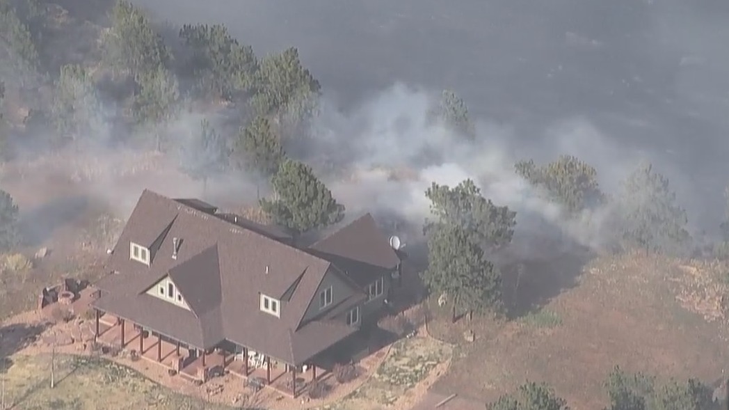 Home close to wildfire in Larimer County