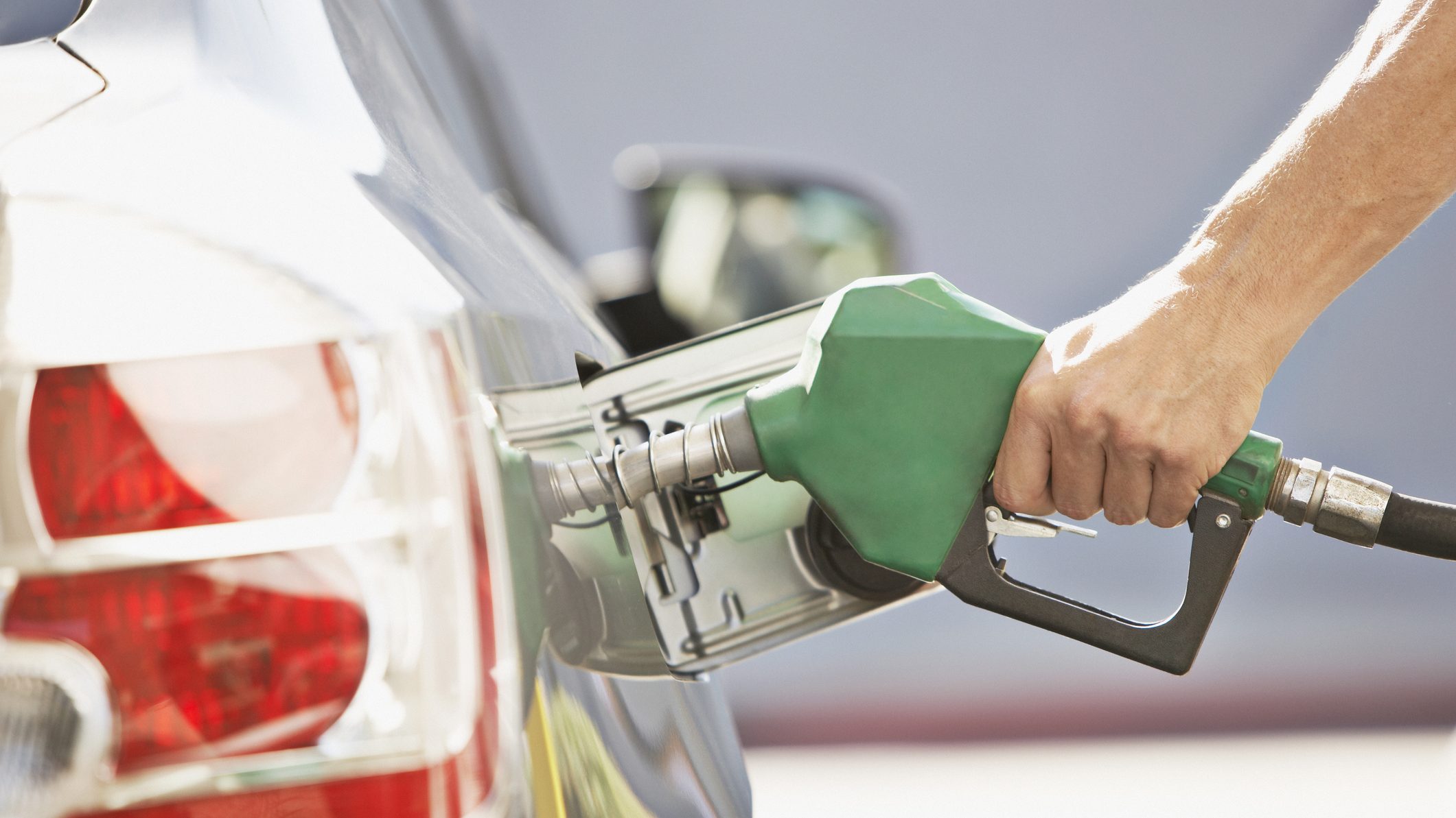 Person pumping gas