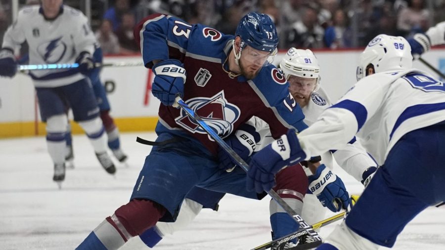 Colorado Avalanche right wing Valeri Nichushkin (13) gets past Tampa Bay Lightning center Steven Stamkos (91) during the second period in Game 2 of the NHL hockey Stanley Cup Final on Saturday, June 18, 2022,