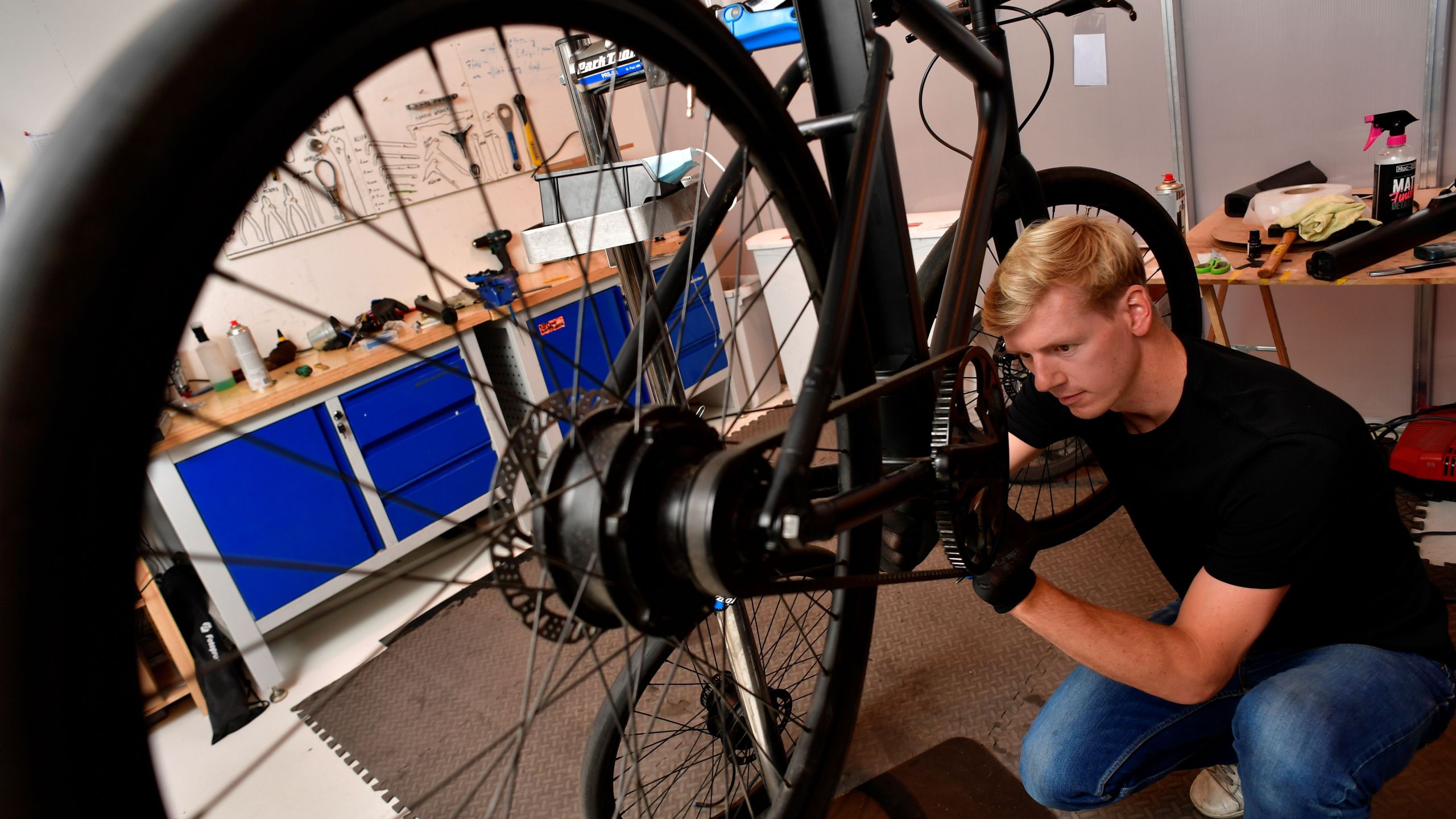 A mechanic works on a Cowboy electric bike, at the company's headquarters in Brussels