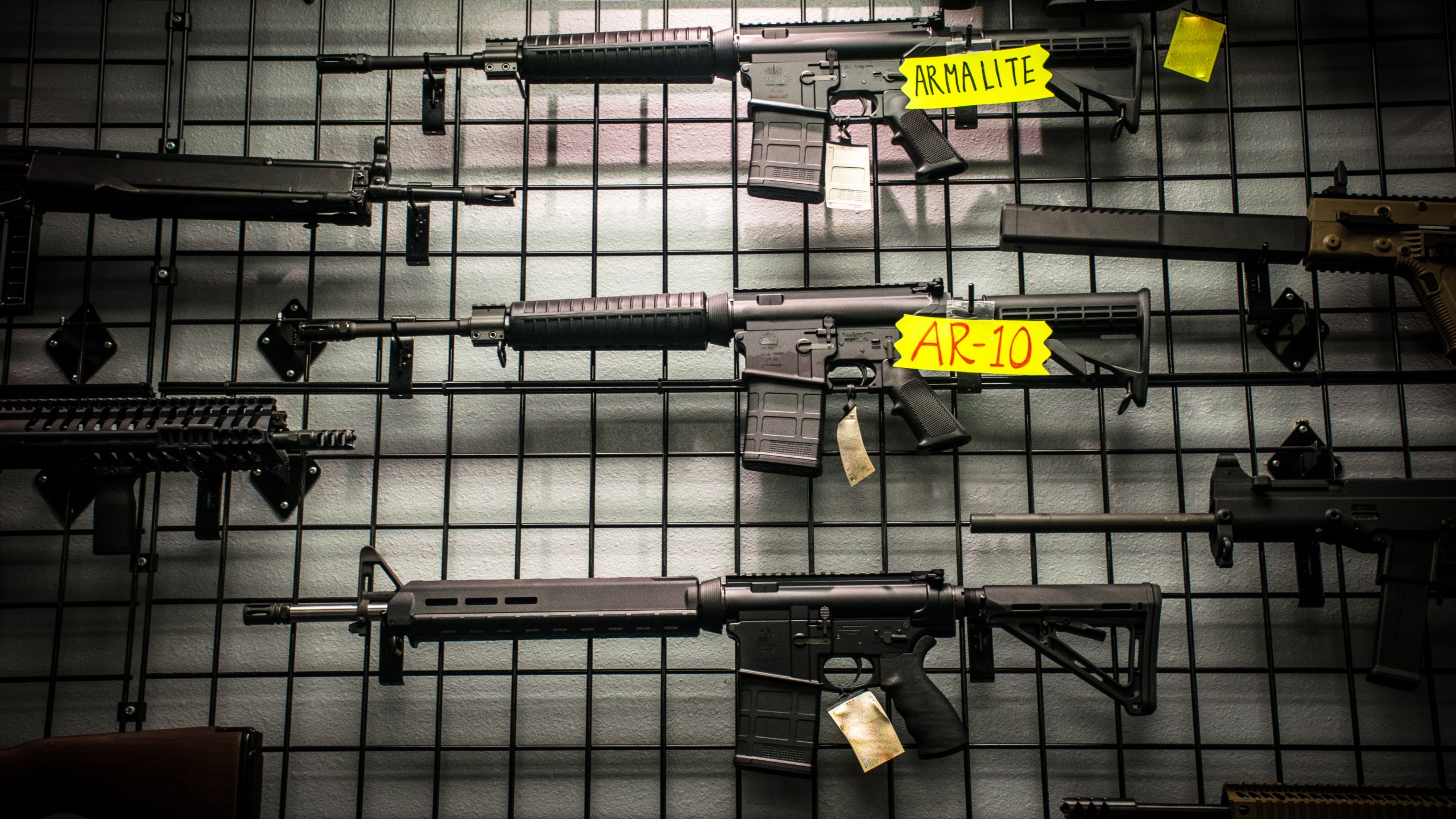 Assault Rifles for sale like the AR-15 and AR-10 hanging on the wall