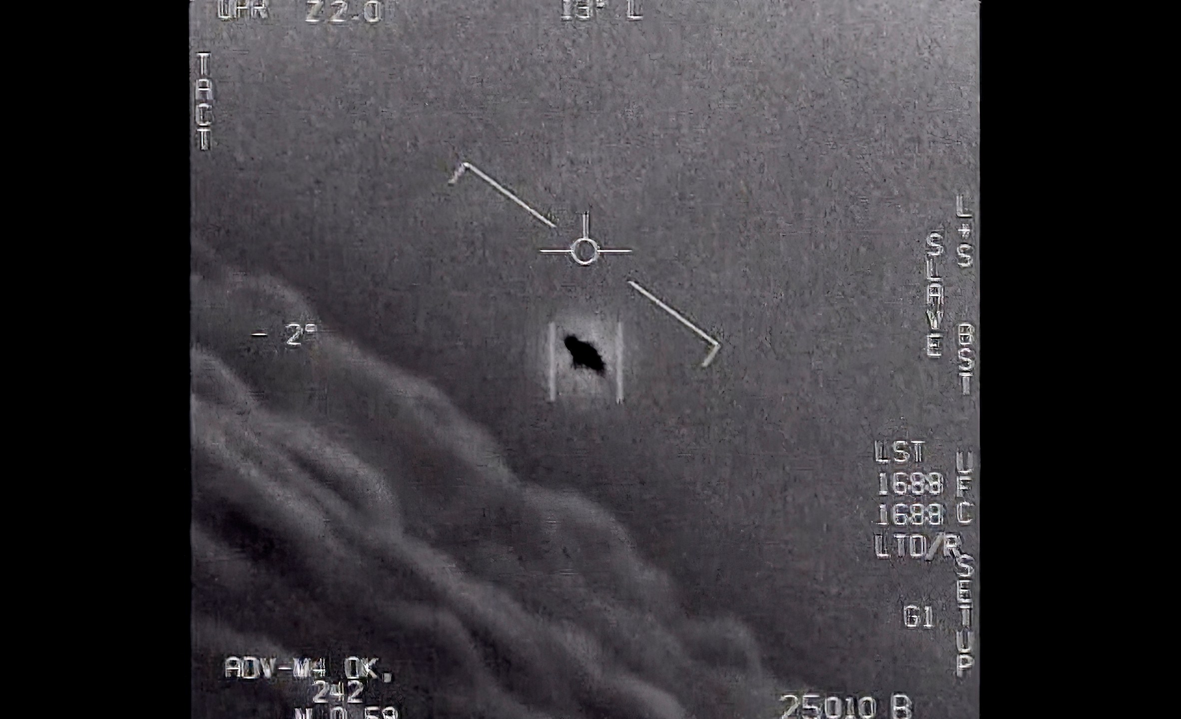 The image from video provided by the Department of Defense labelled Gimbal, from 2015, an unexplained object is seen at center as it is tracked as it soars high along the clouds, traveling against the wind. “There's a whole fleet of them,” one naval aviator tells another, though only one indistinct object is shown. “It's rotating." The U.S. government has been taking a hard look at unidentified flying objects, under orders from Congress, and a report summarizing what officials know is expected to come out in June 2021.