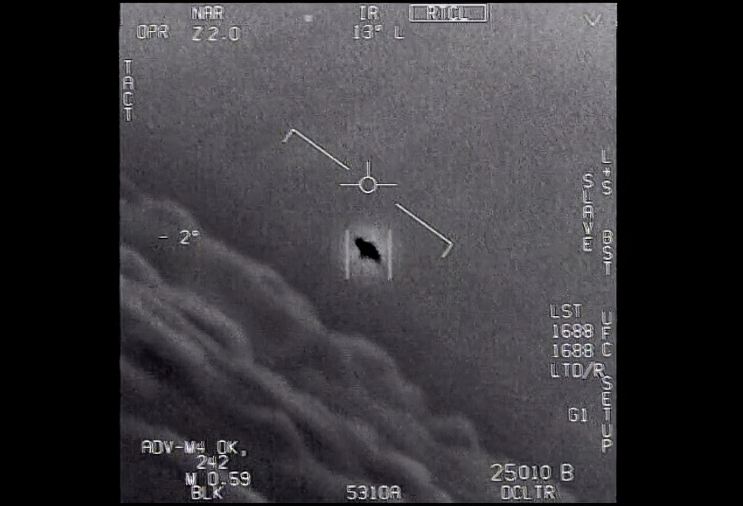 The image from video provided by the Department of Defense labelled Gimbal, from 2015, an unexplained object is seen at center as it is tracked as it soars high along the clouds, traveling against the wind. “There's a whole fleet of them,” one naval aviator tells another, though only one indistinct object is shown. “It's rotating." The U.S. government has been taking a hard look at unidentified flying objects, under orders from Congress, and a report summarizing what officials know is expected to come out in June 2021.