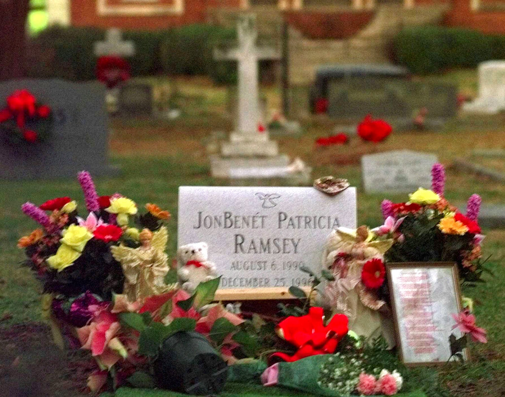 Flowers, pictures and stuffed animals adorn the gravesite of JonBenet Patricia Ramsey