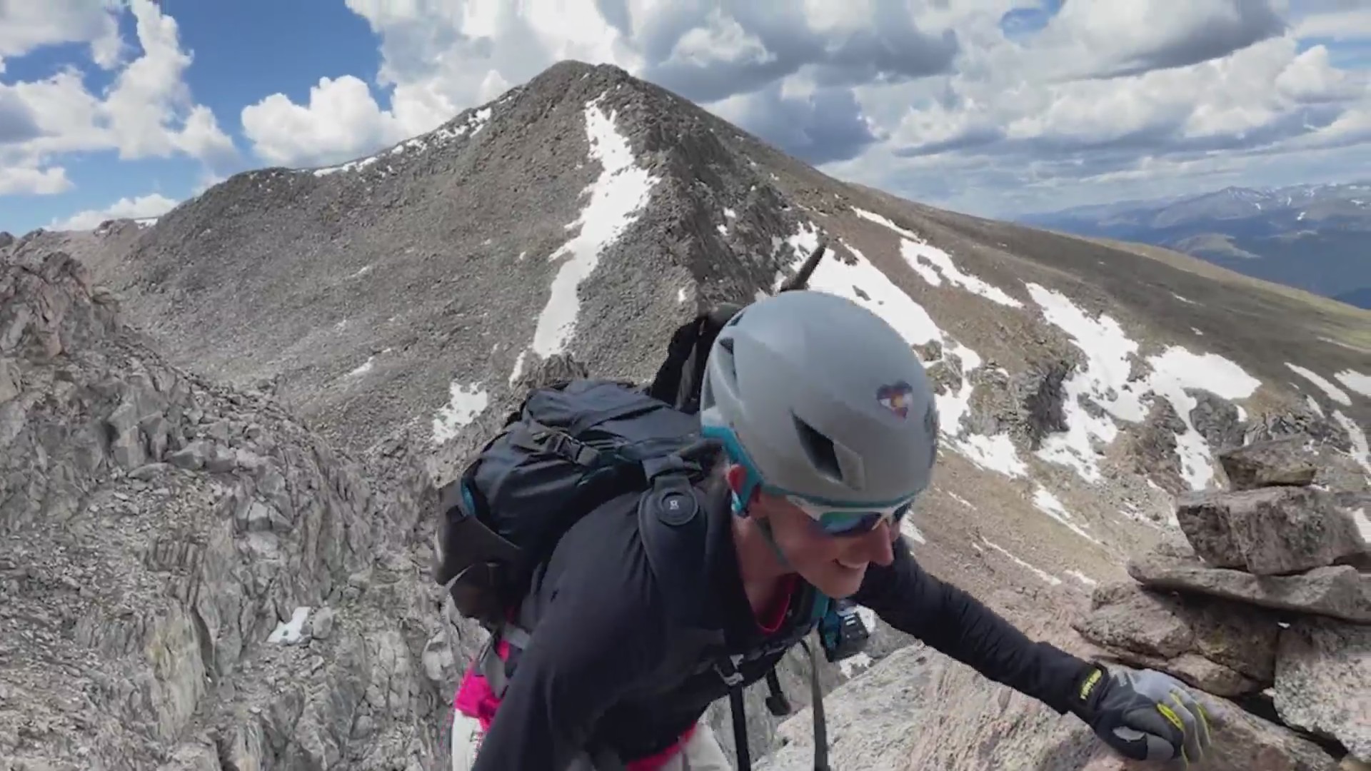 Beth Leleck atop a mountain