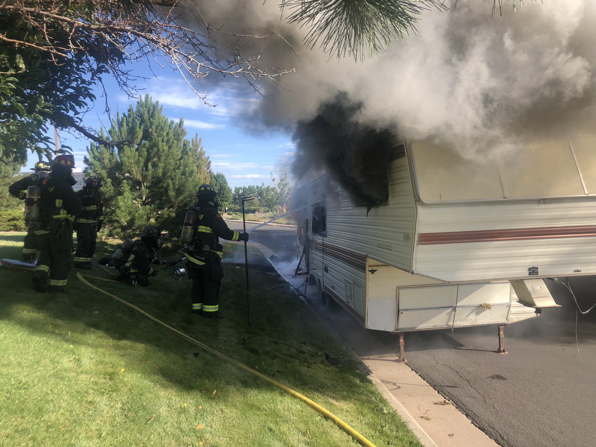 Firefighters extinguish flames after RV explosion