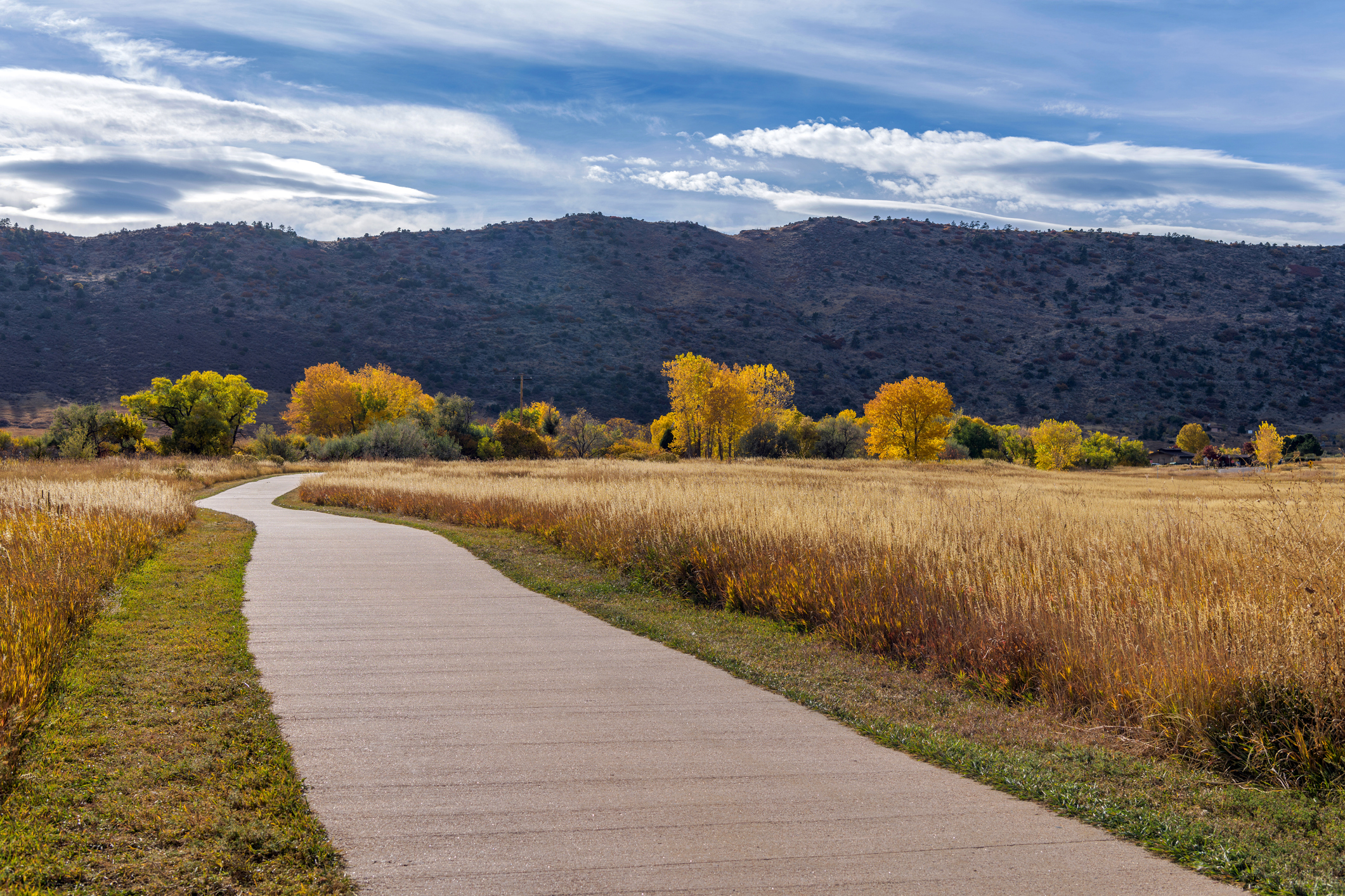 A sunny Autumn day view of a winding biking and hiking path