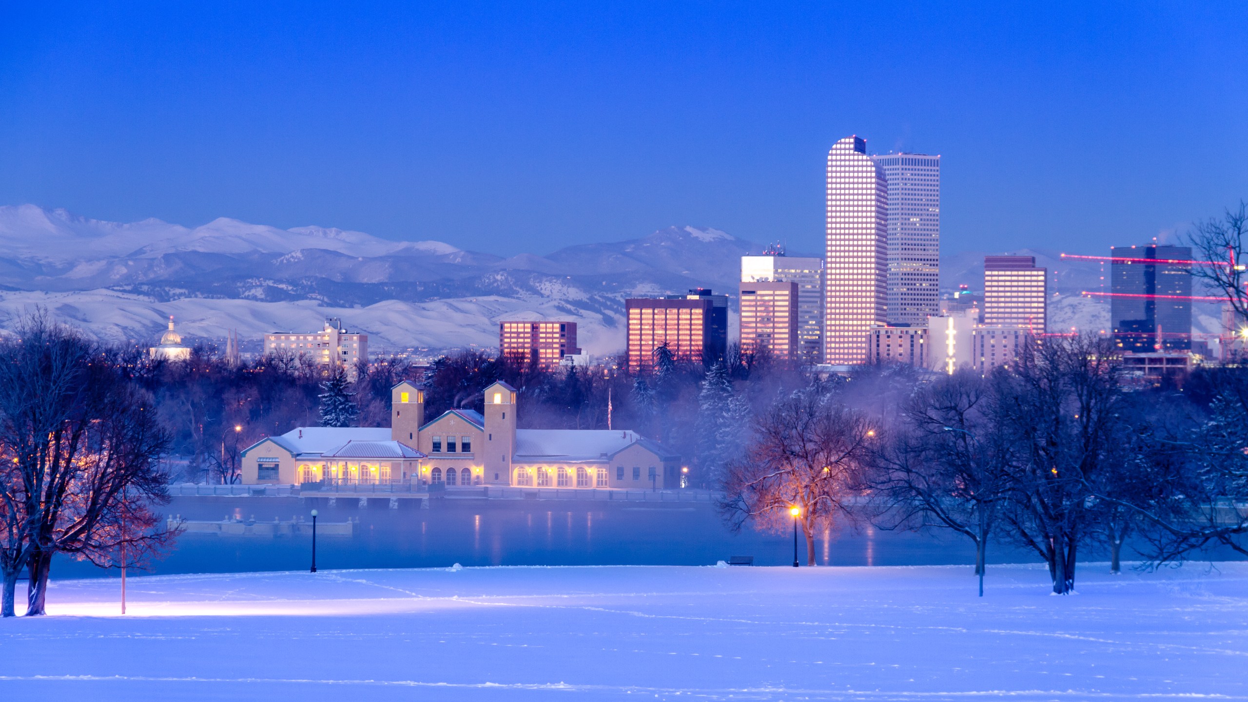 Denver skyline at sunrise, day after winter snowstorm, from City Park and Denver Museum of Science and Nature