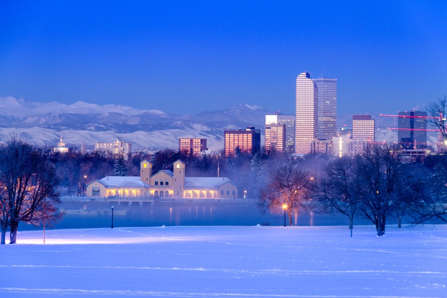 Denver skyline at sunrise, day after winter snowstorm, from City Park and Denver Museum of Science and Nature