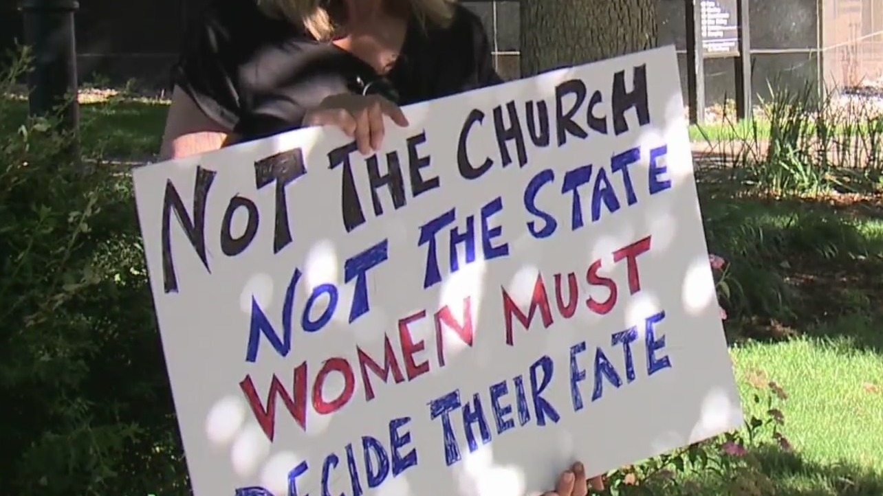 Poster that reads "Not the church not the state women must decide their fate"