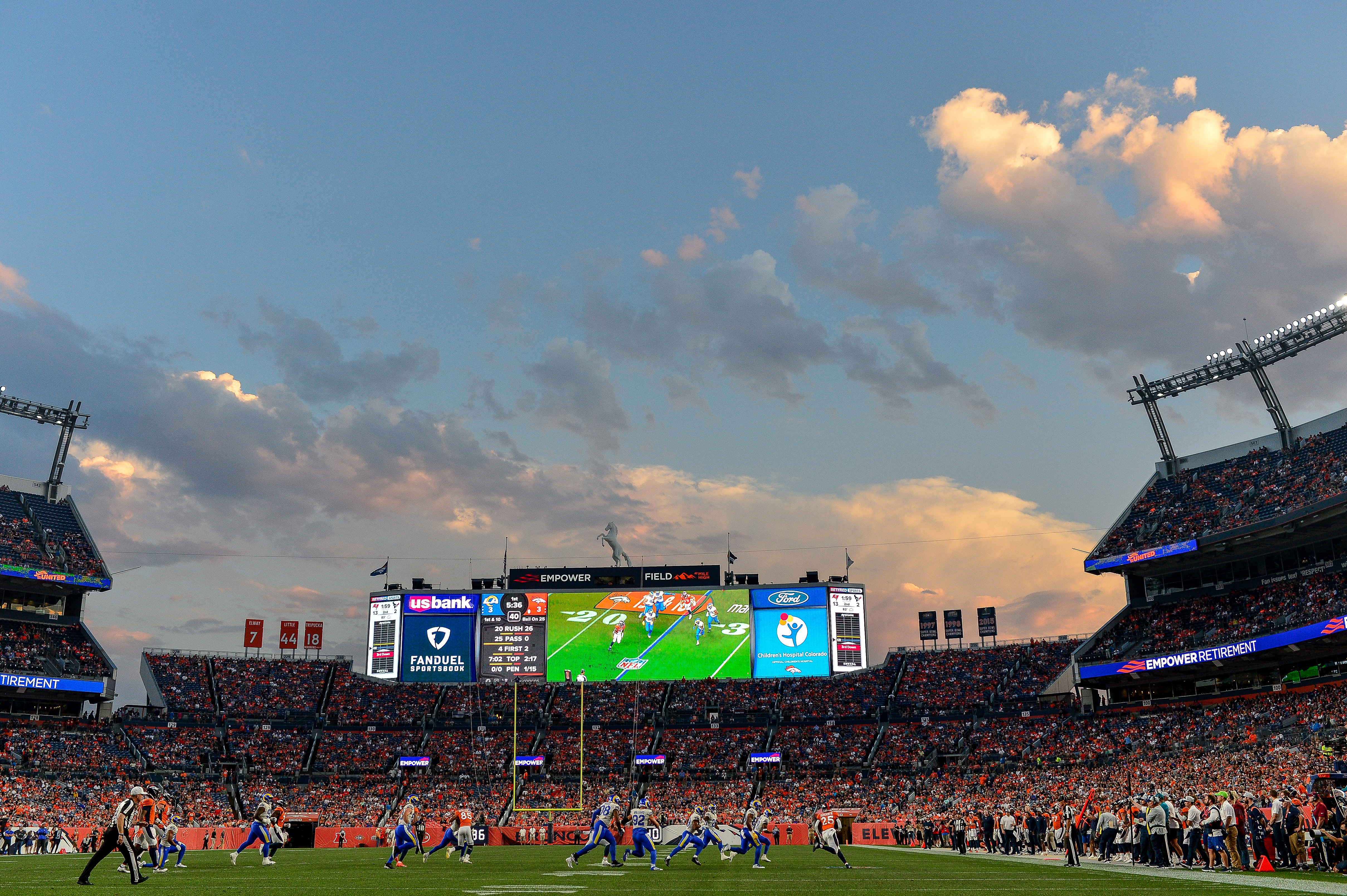 Inside Empower Field during evening Broncos game