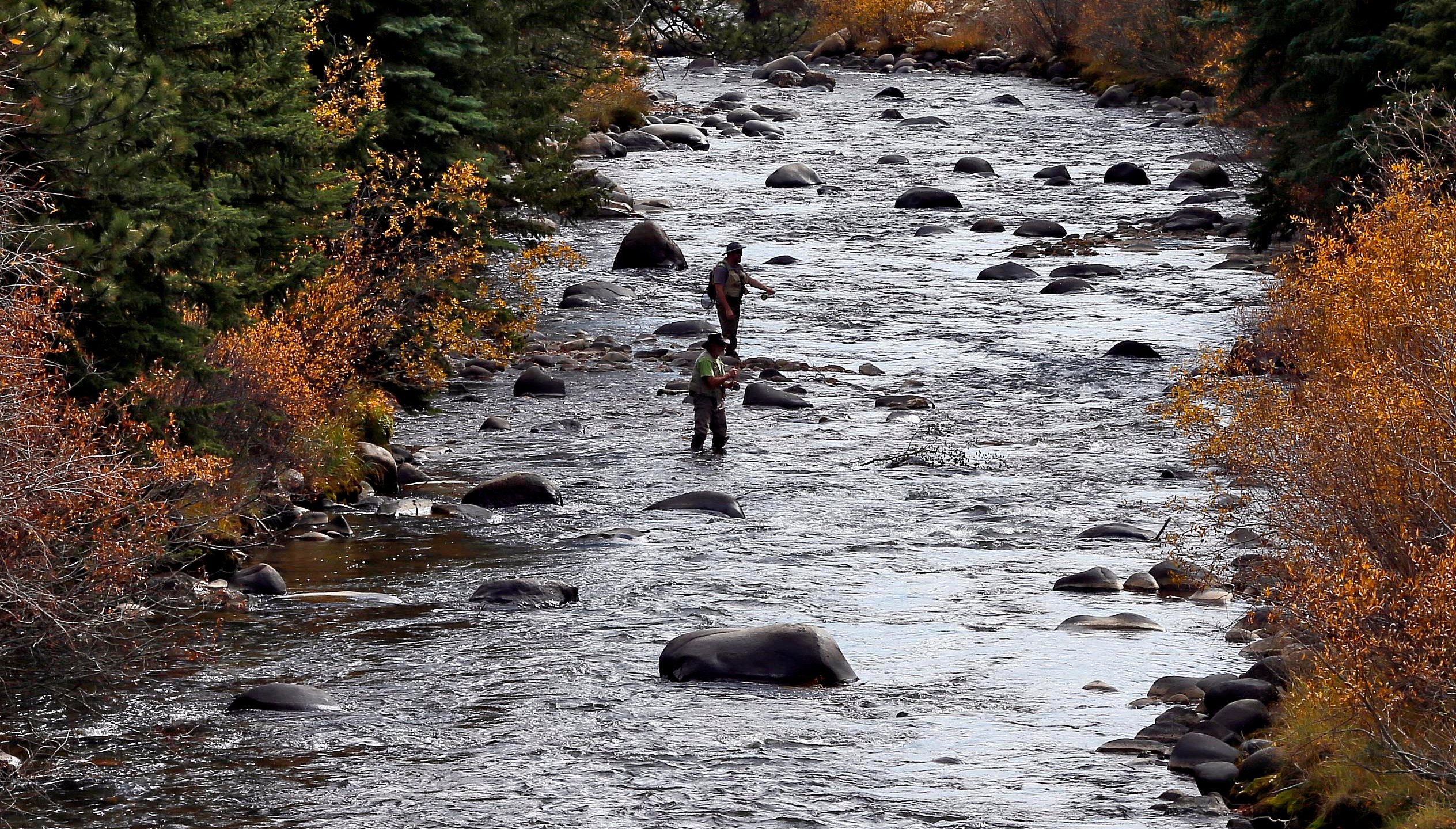 Fishermen cast their lines in Clear Creek