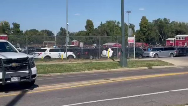 Students outside East High School while police investigate threat