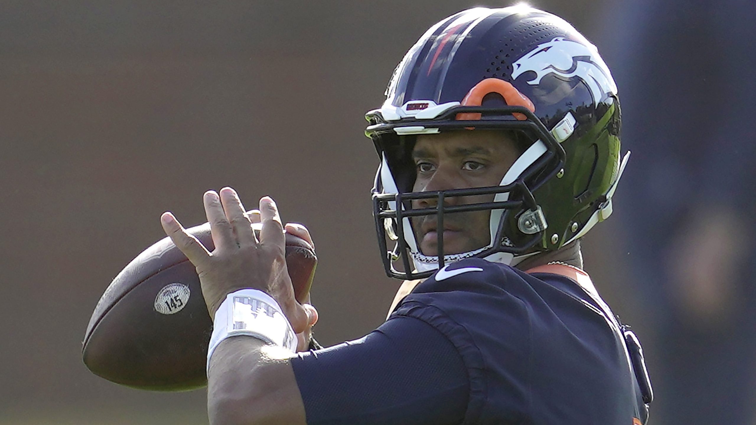 Denver Broncos quarterback Russell Wilson throws the ball during practice