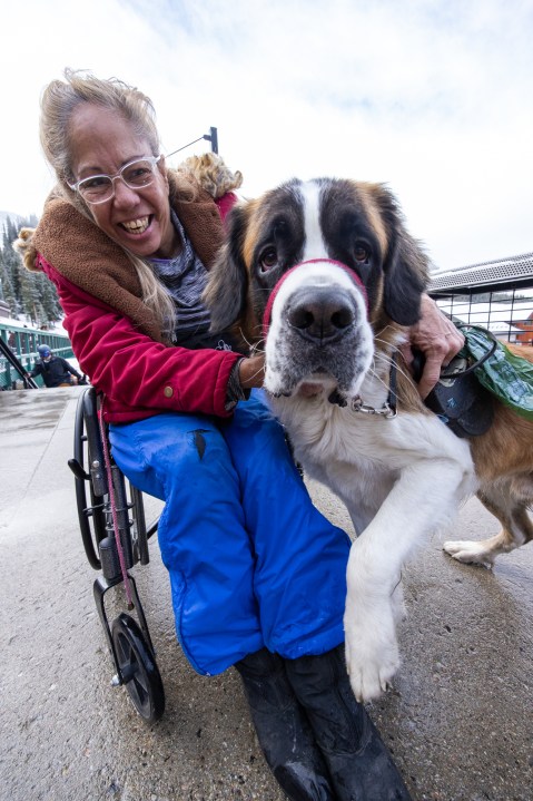 Dog and owner at Arapahoe Basin opening day