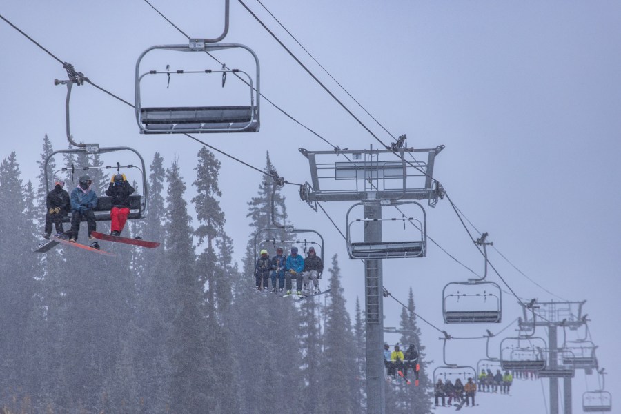 Snowy lift rides at Arapahoe Basin on opening day