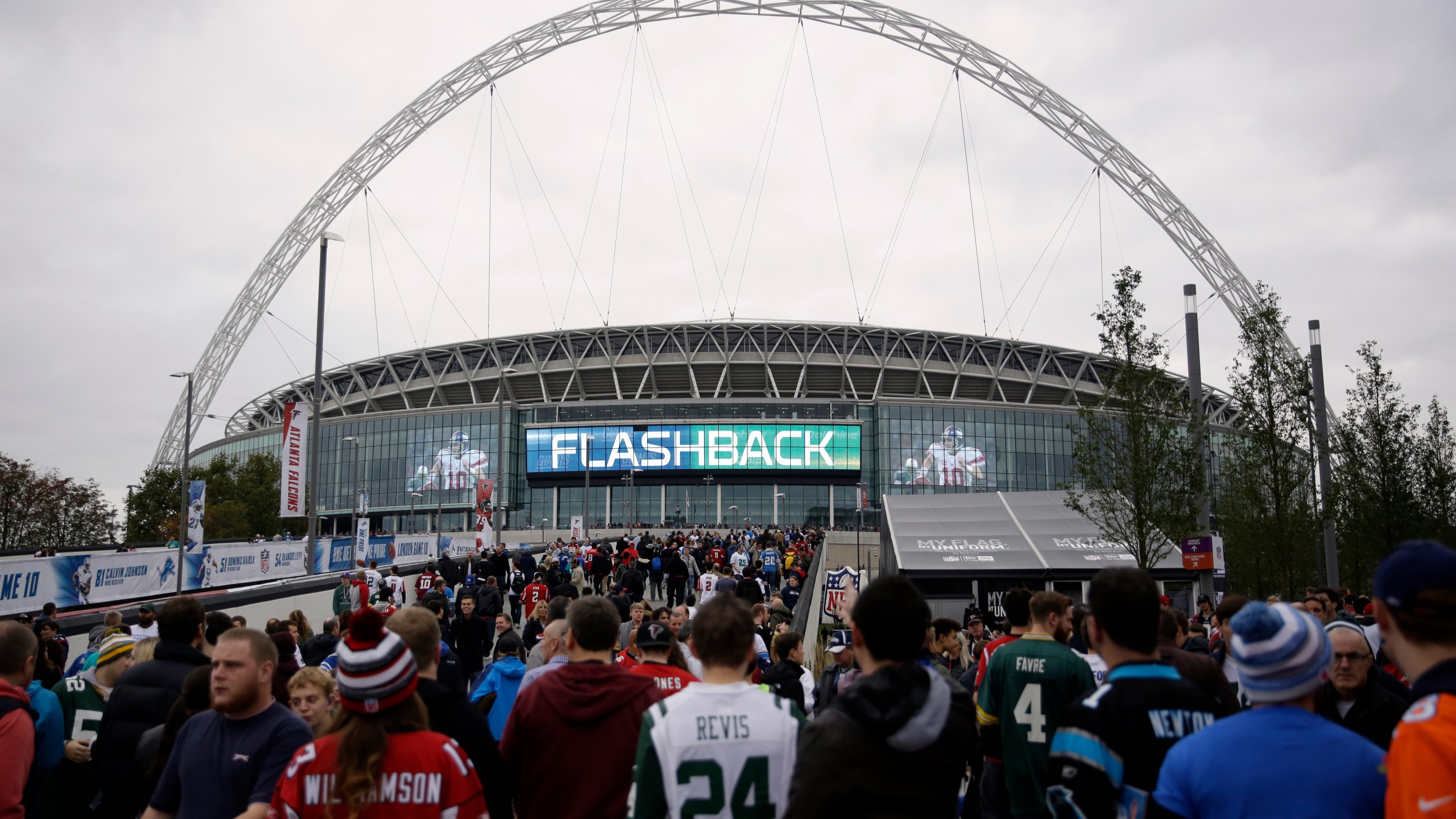 fans arrive at Wembley Stadium before an NFL football game