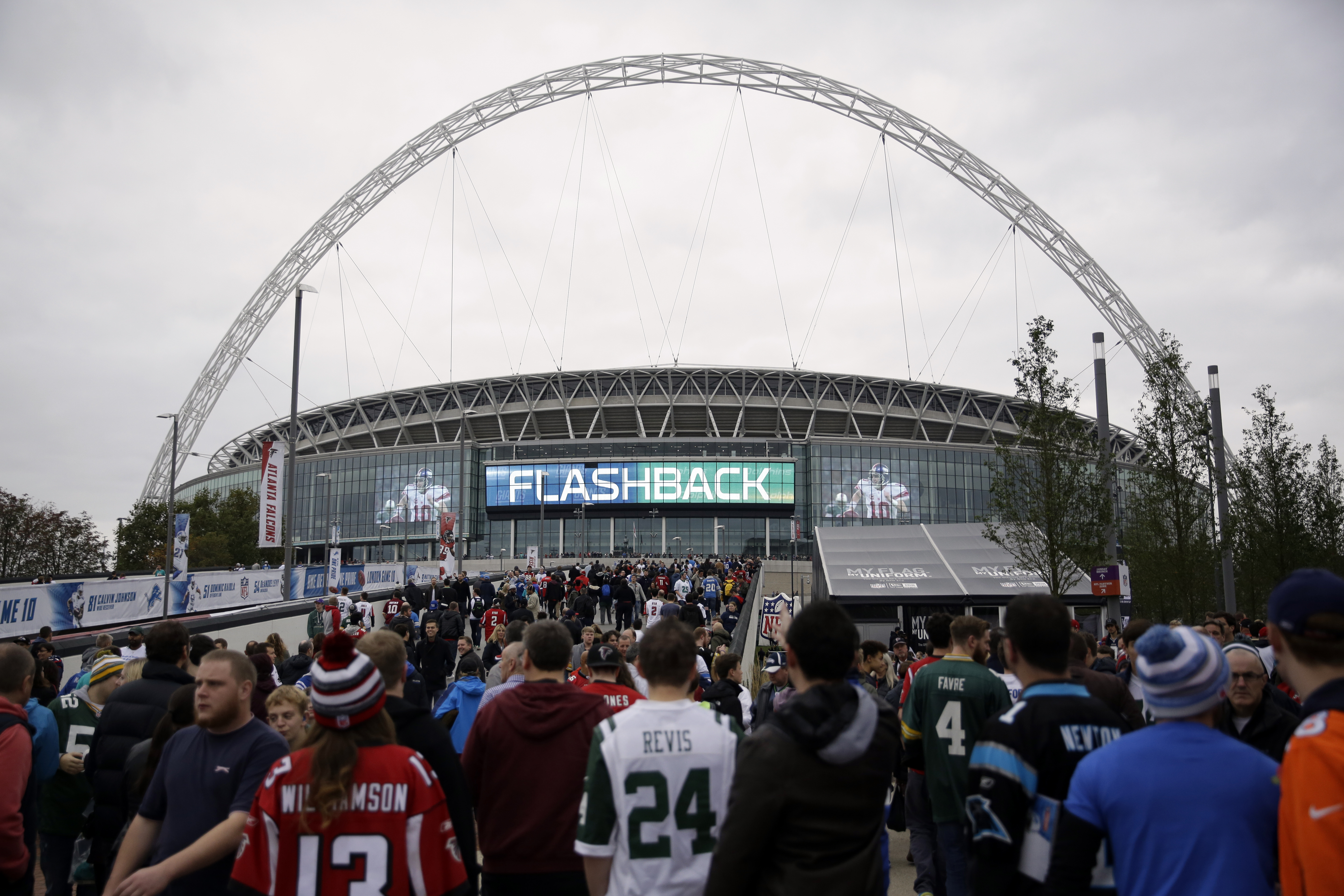 fans arrive at Wembley Stadium before an NFL football game