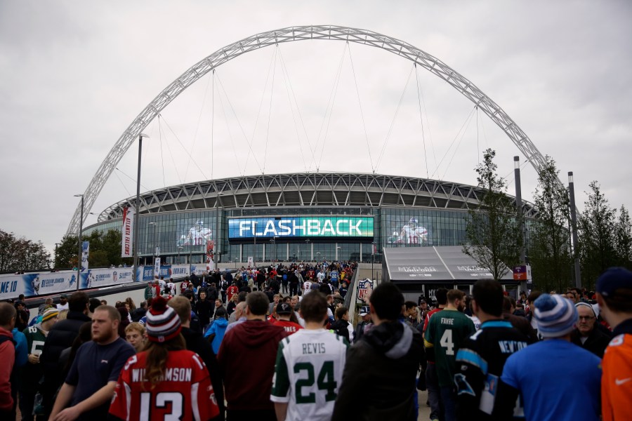 fans arrive at Wembley Stadium before an NFL football game