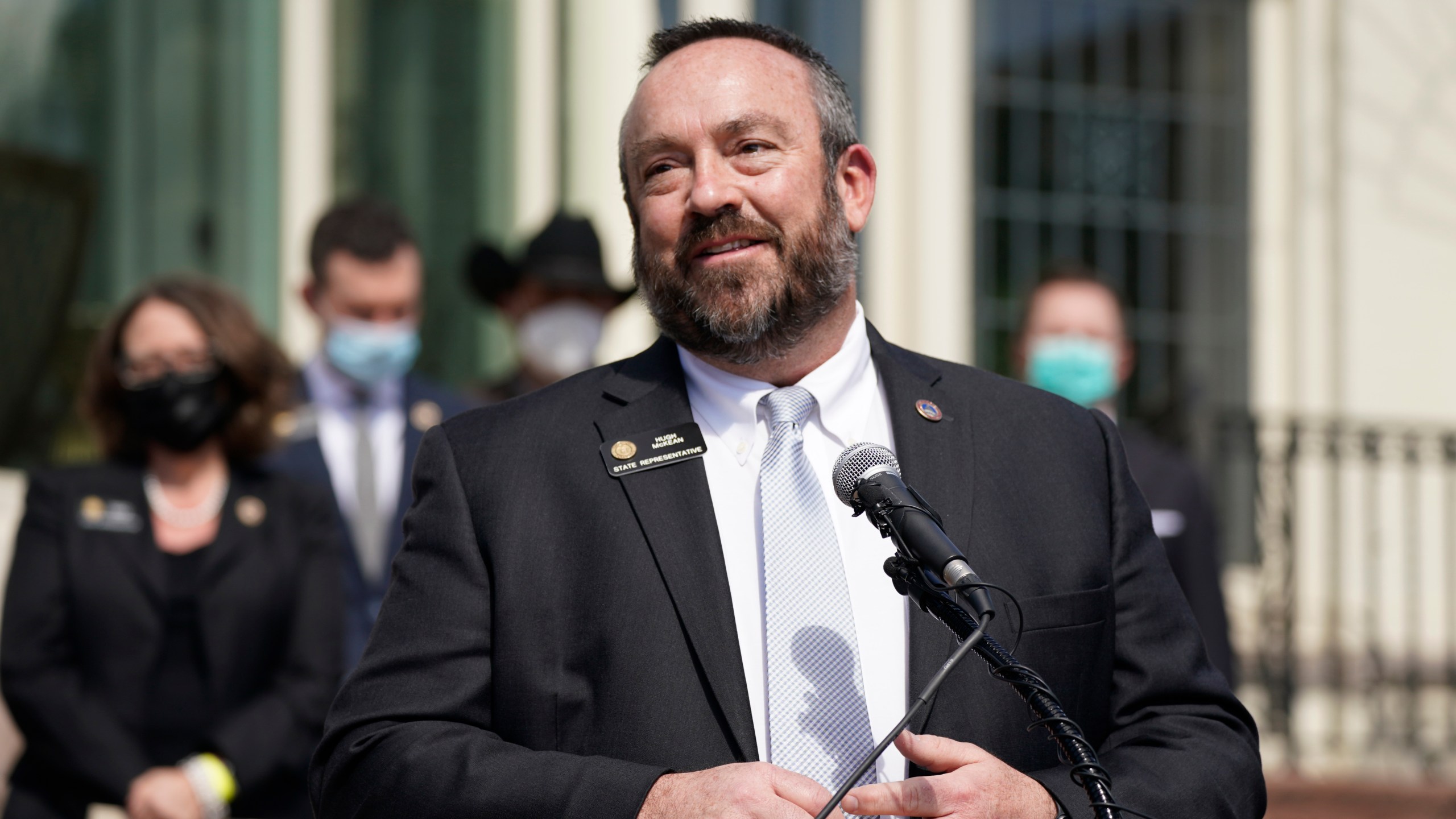 House Minority Leader Hugh McKean speaks during a news conference outside the Governor's mansion