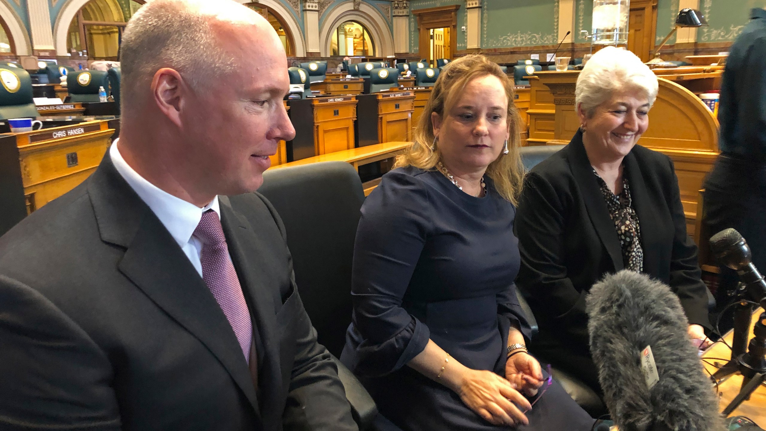 Colorado Republican Sen. Kevin Priola, left, Democratic House Speaker KC Becker, center, and Democratic Sen. Lois Court inside the Colorado Capitol