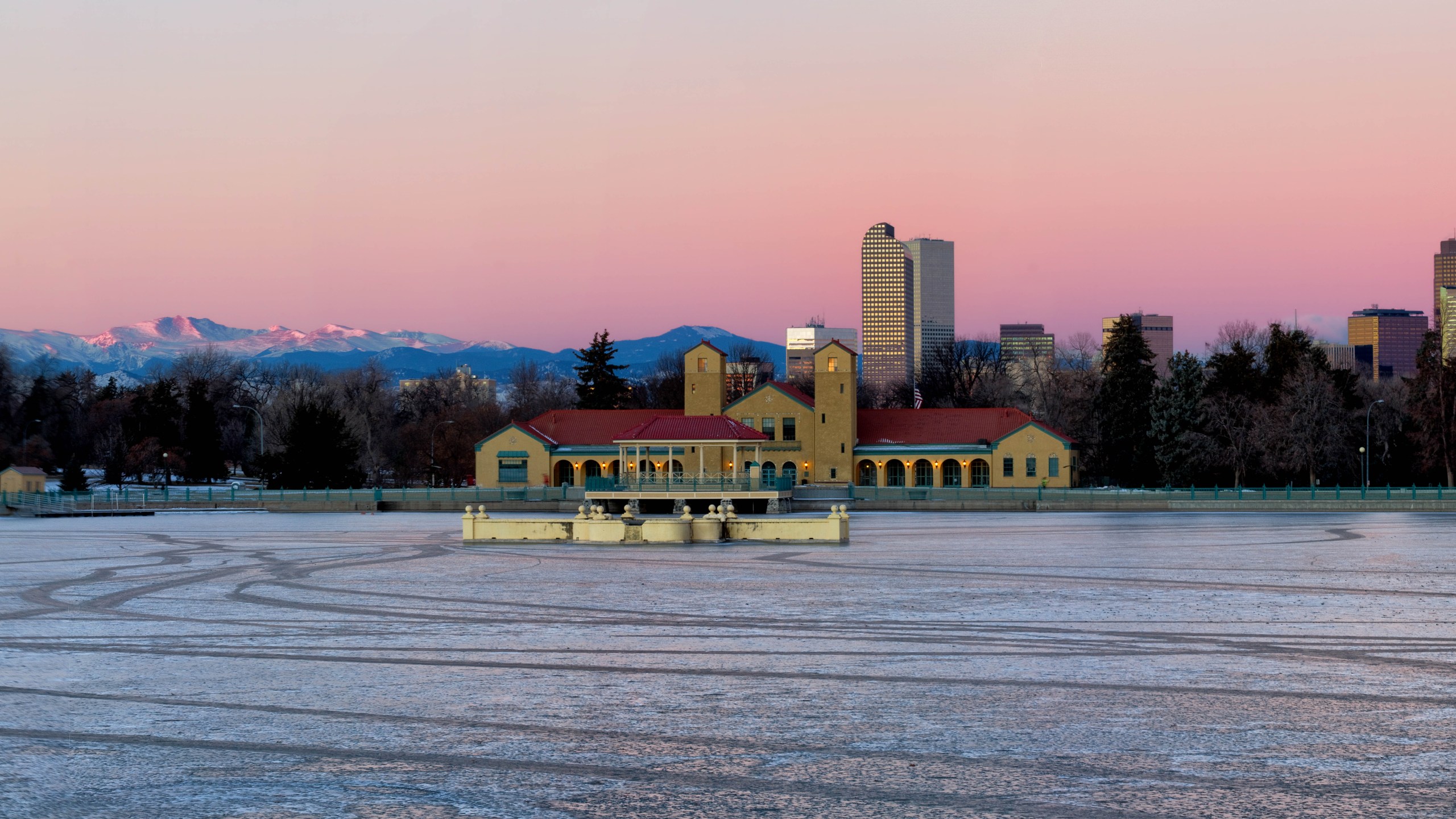 Early morning sunrise on Denver City Park in the winter with a frozen lake