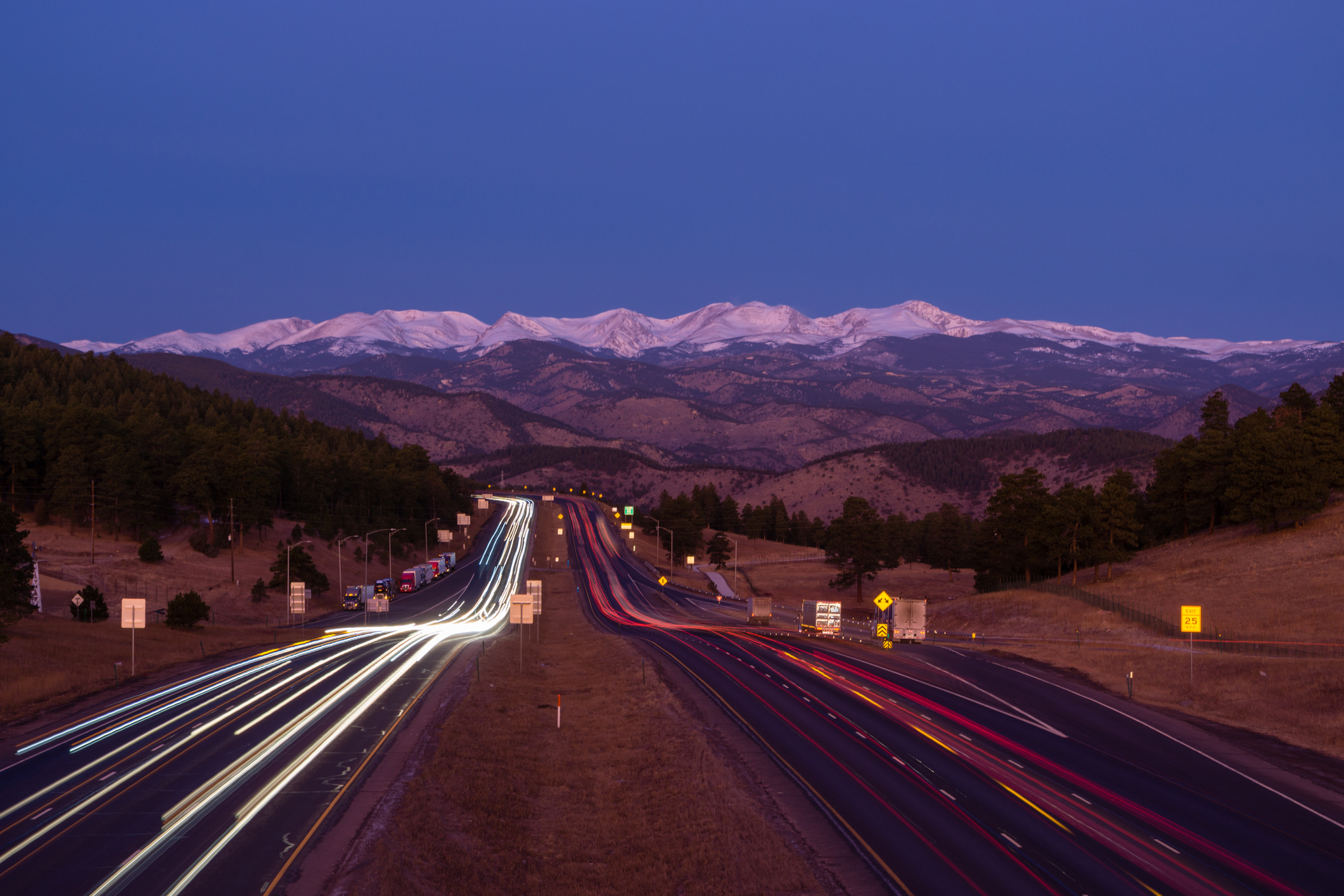 Evening time lapse of traffic on I-70 westbound at twilight