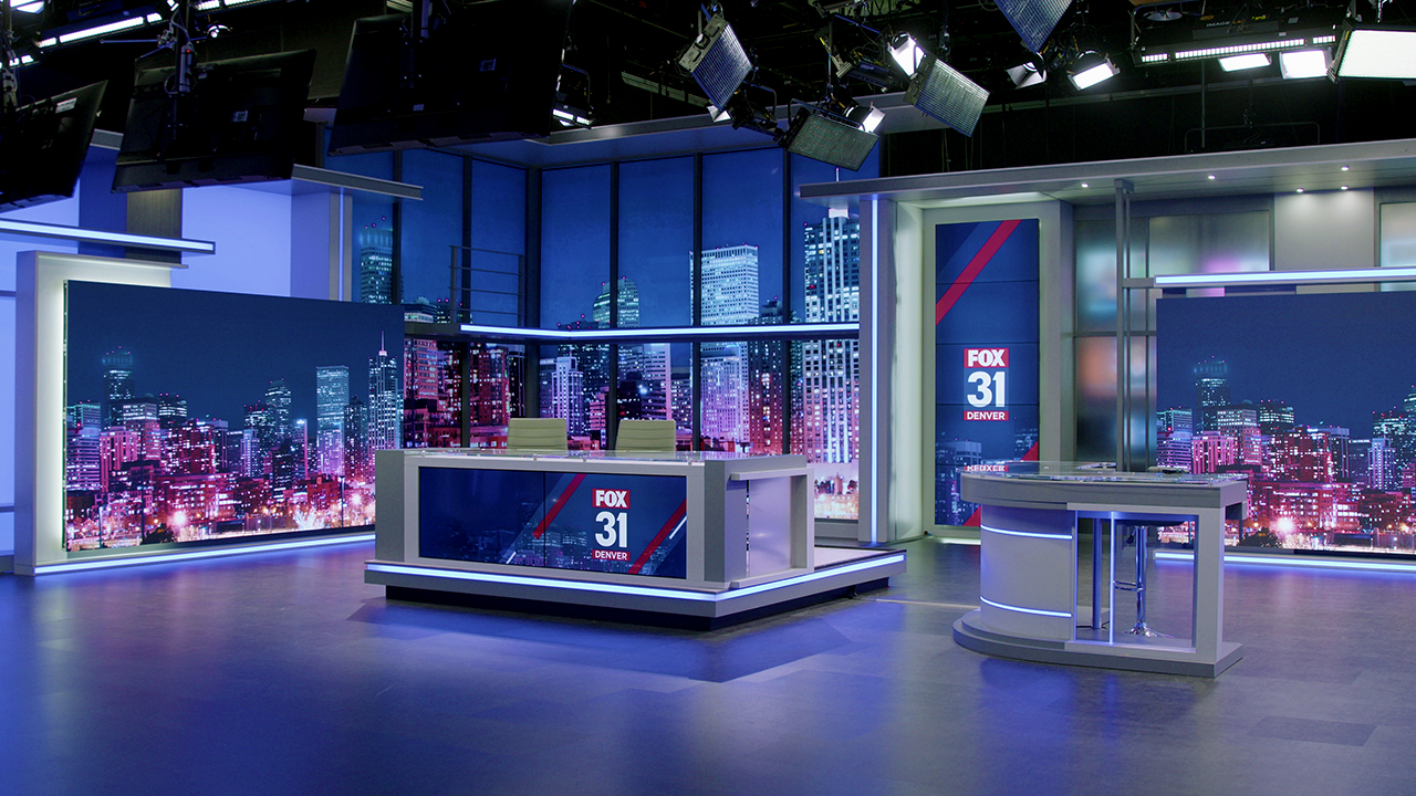 The news and weather desks are seen on FOX31's new set.