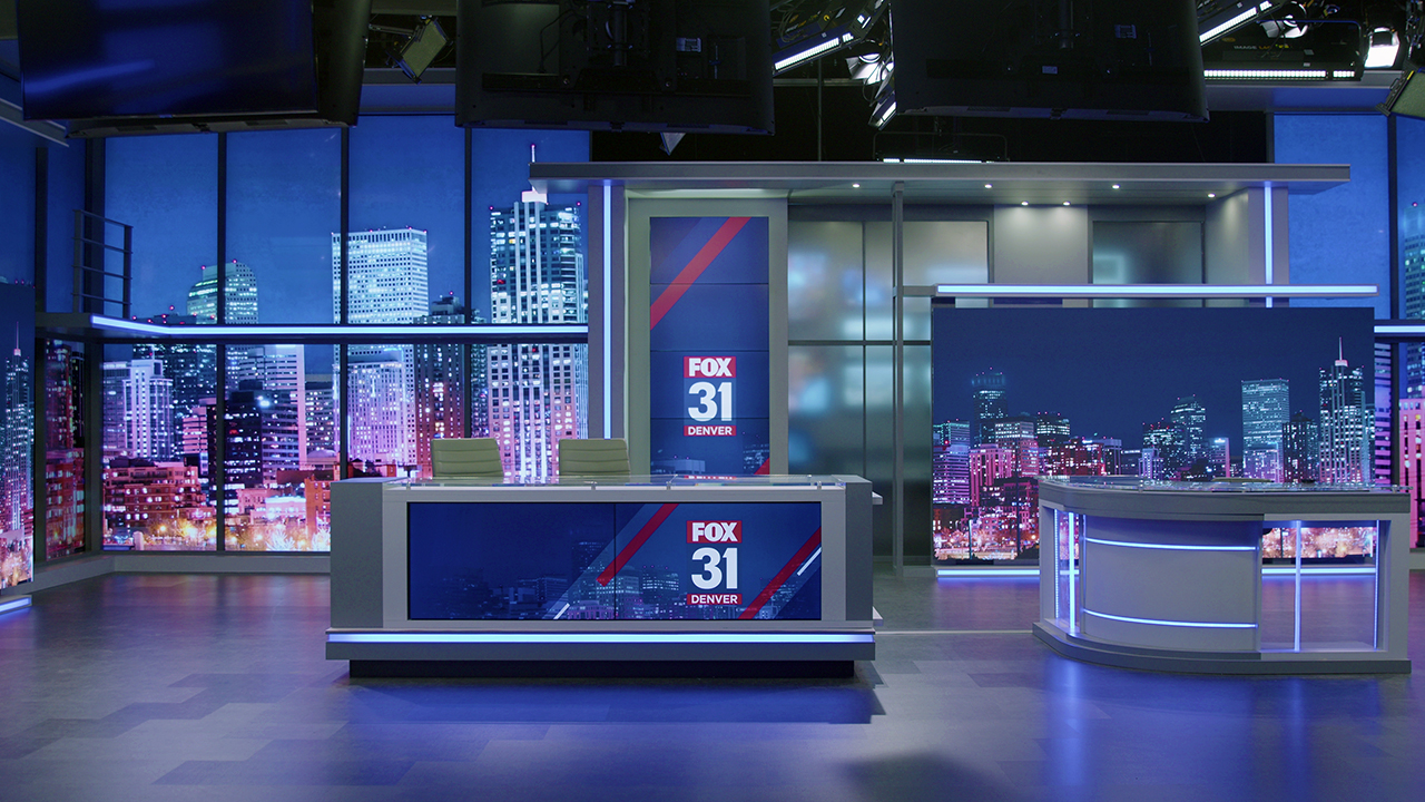 The news and weather desks are seen on FOX31's new set.