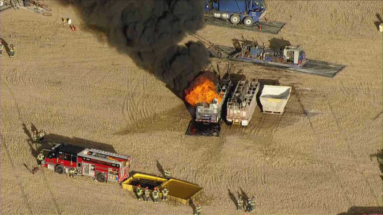 Aerial view of black smoke billowing from a fire