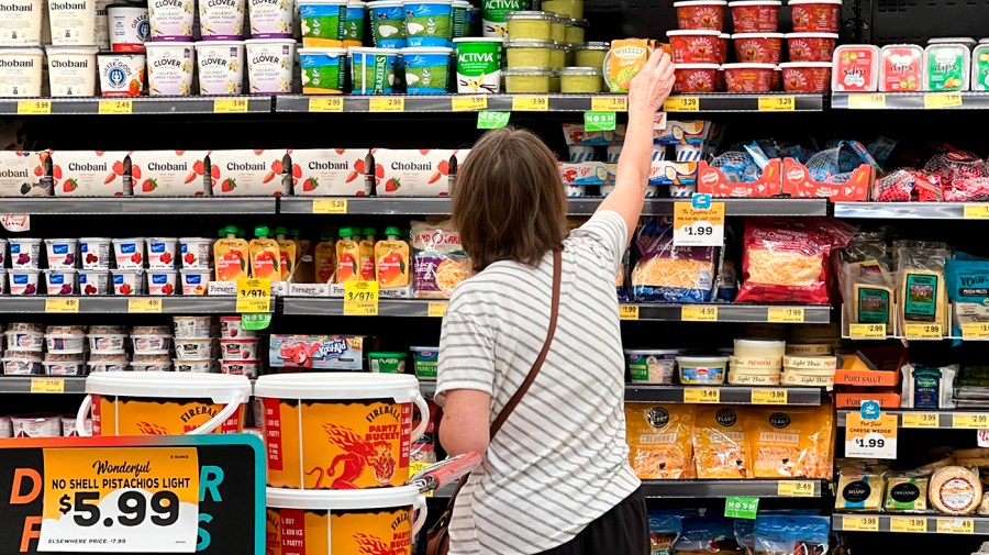 A customer looks at refrigerated items