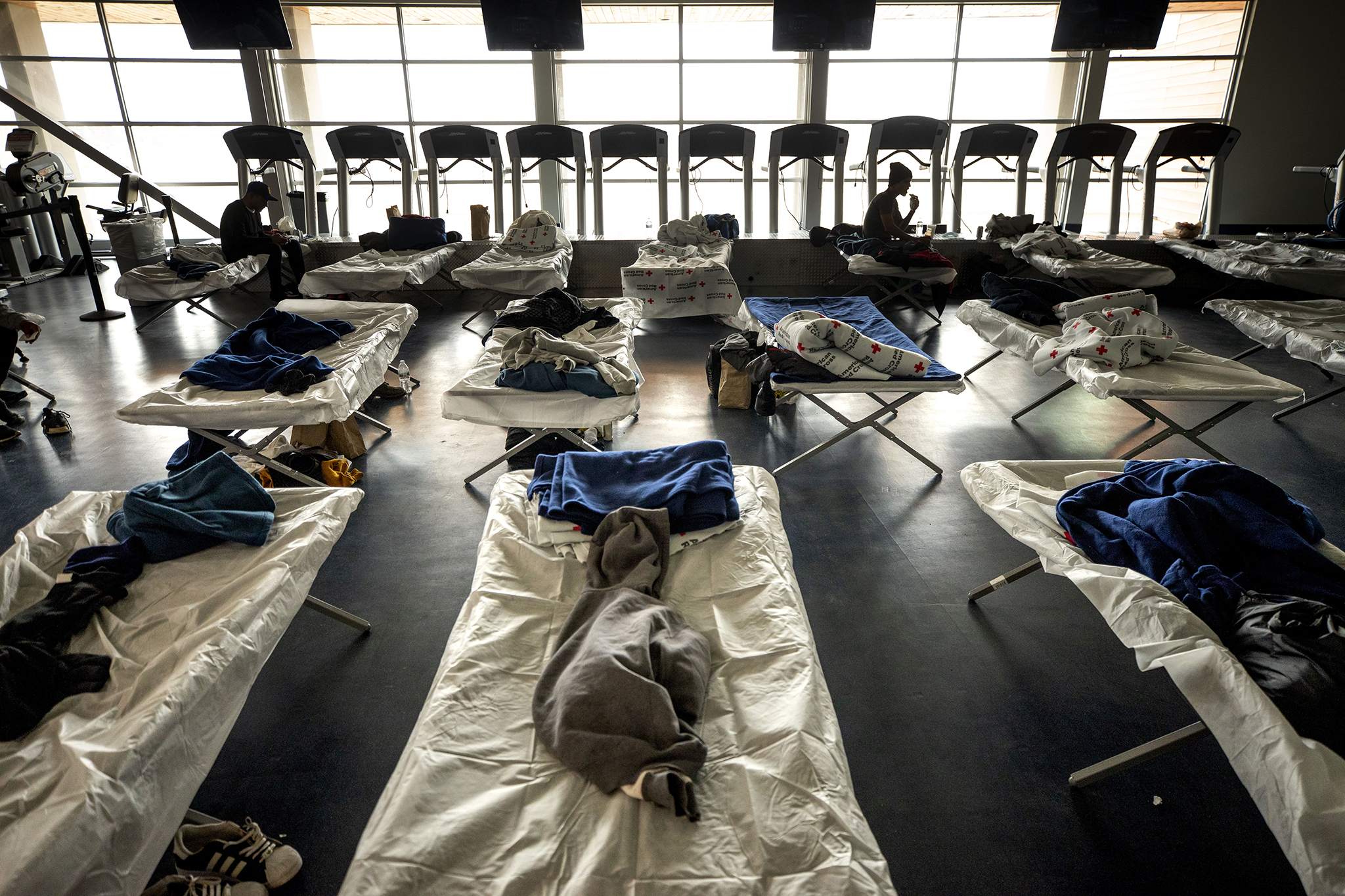 Cots set up in an emergency shelter for people arriving from the southern U.S. border, set up at a Denver rec center