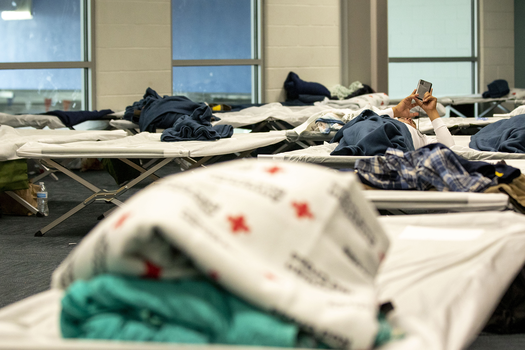 Cots set up in an emergency shelter for people arriving from the southern U.S. border, set up at a Denver rec center