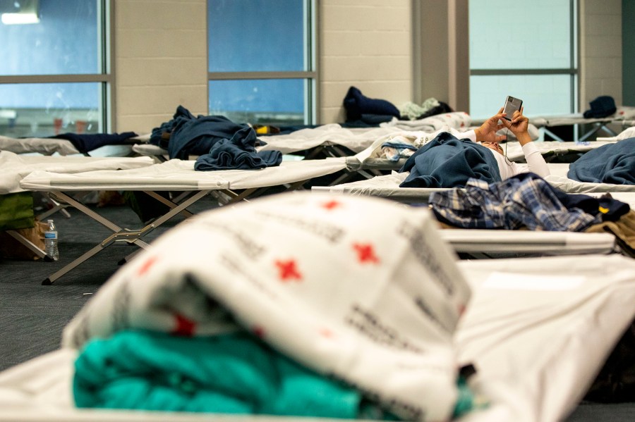 Cots set up in an emergency shelter for people arriving from the southern U.S. border, set up at a Denver rec center