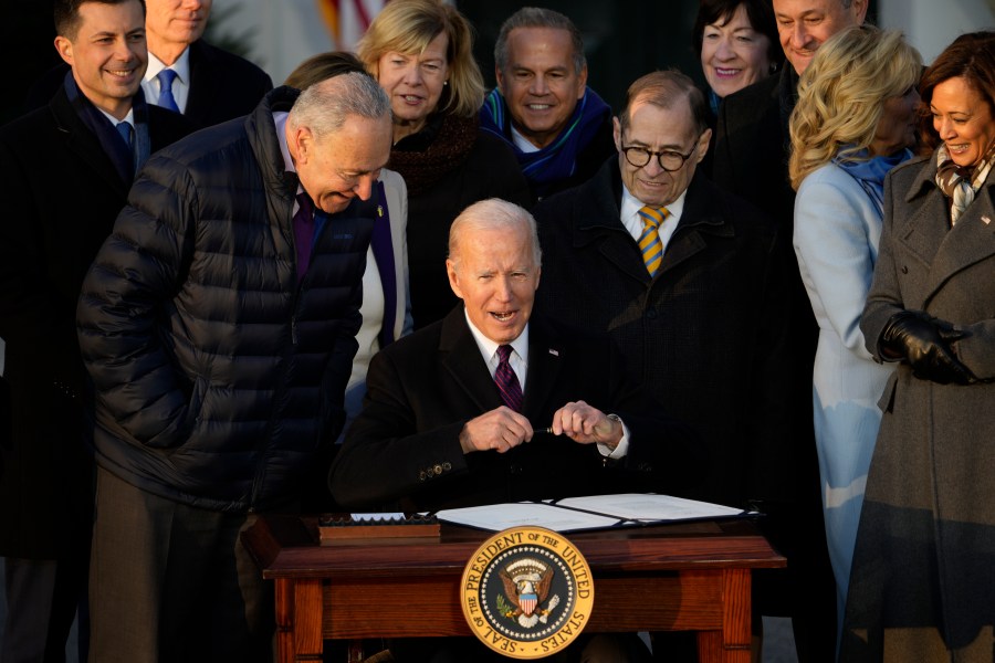 President Joe Biden signs the Respect for Marriage Act on the South Lawn of the White House