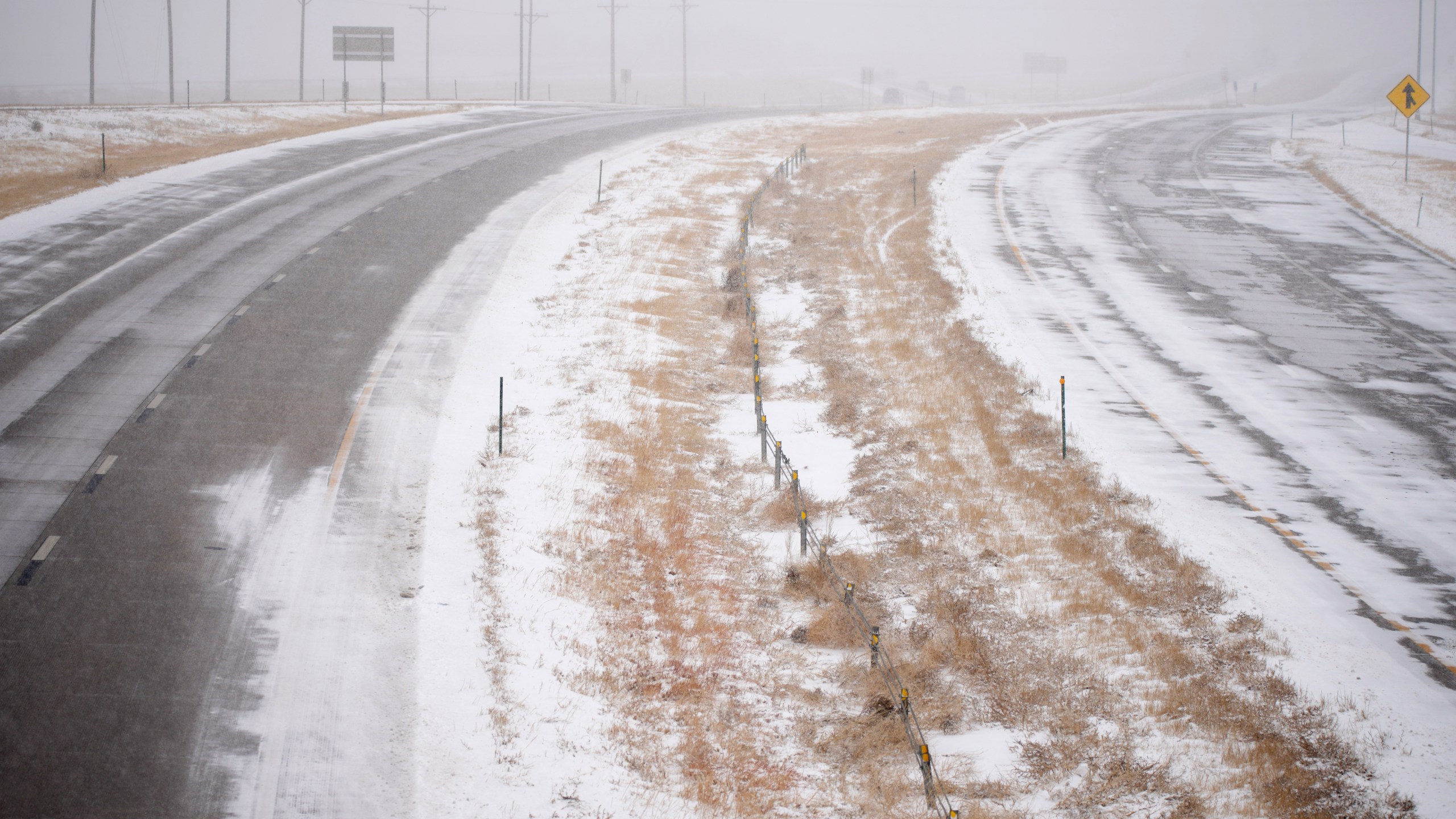 westbound and eastbound lanes of Interstate 70 are devoid of traffic near East Airpark Road