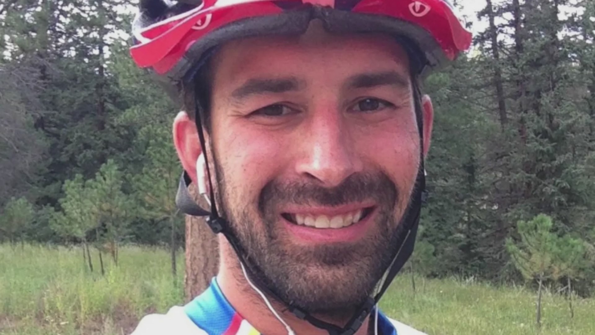 A man in a helmet in the forest