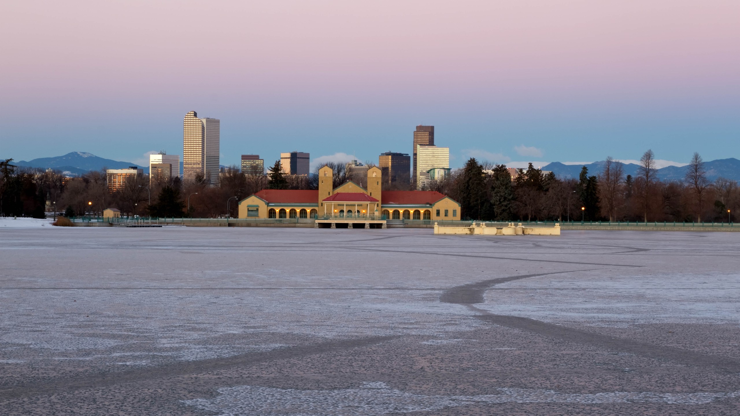 Eary morning sunrise on Denver City Park in the winter with a frozen lake